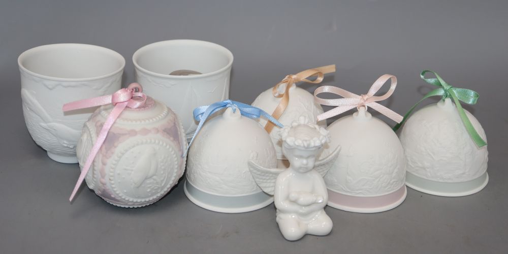 A collection of ceramic bells, Lladro etc.